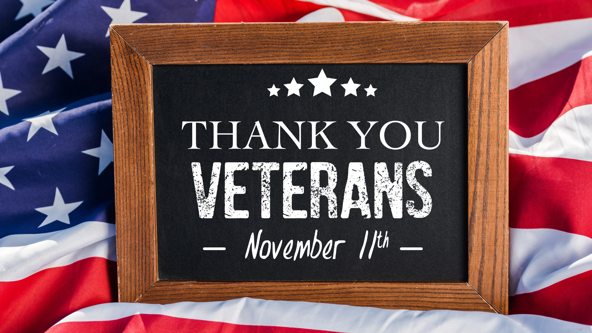 chalkboard with thank you veterans illustration on American flag with stars and stripes