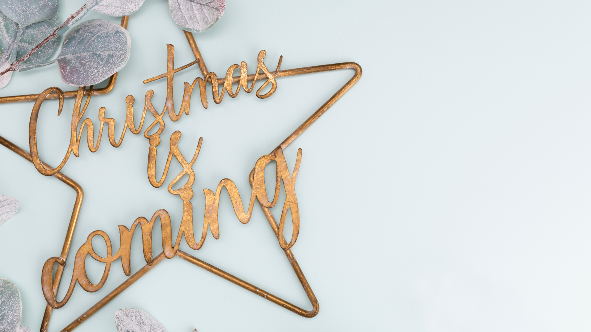 Festive pastel background. Christmas stars and shining glitter, confetti on pastel background. Christmas background, Flat lay.